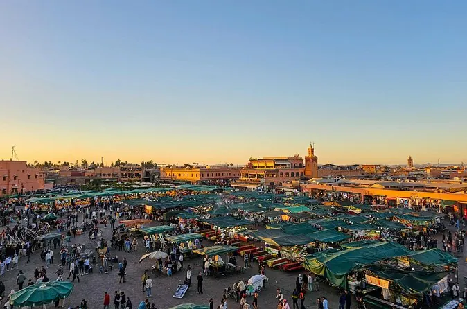Jemaa el-Fna square in Marrakech at sunset with food stall canopies